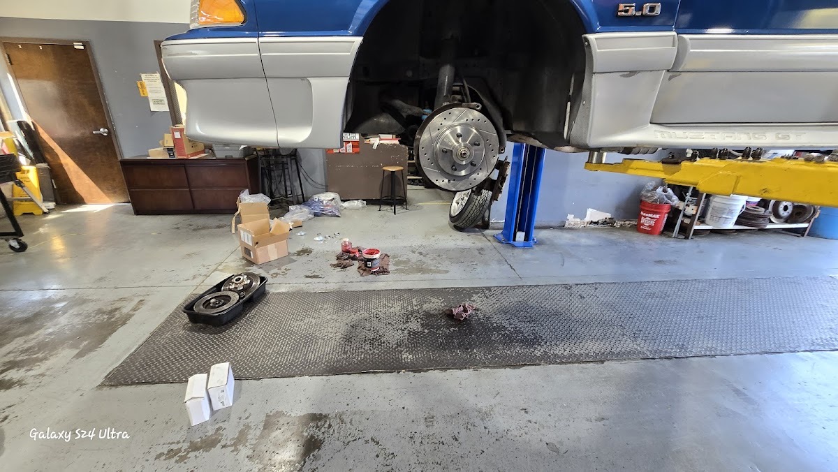 A vehicle up on the lift at Liberty Auto with the brake rotor exposed